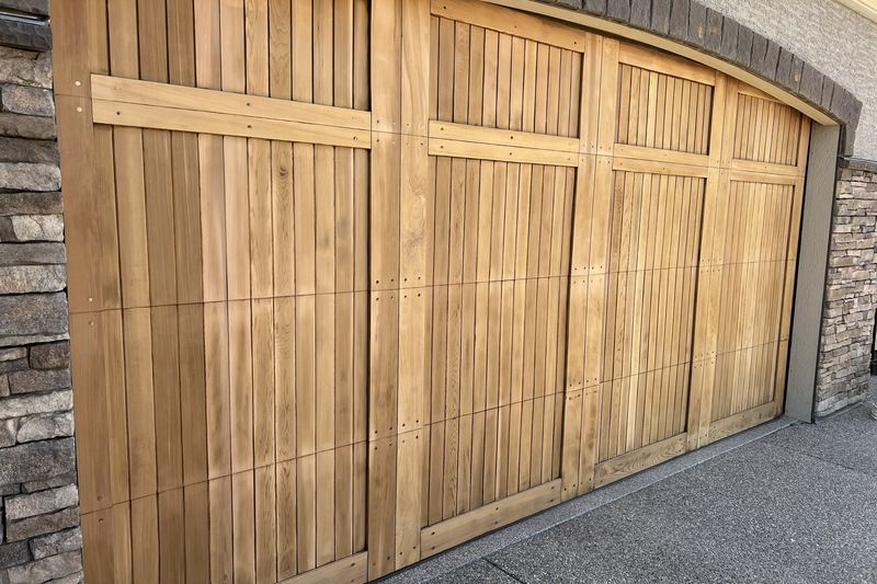 cedar garage door after sanding before refinishing